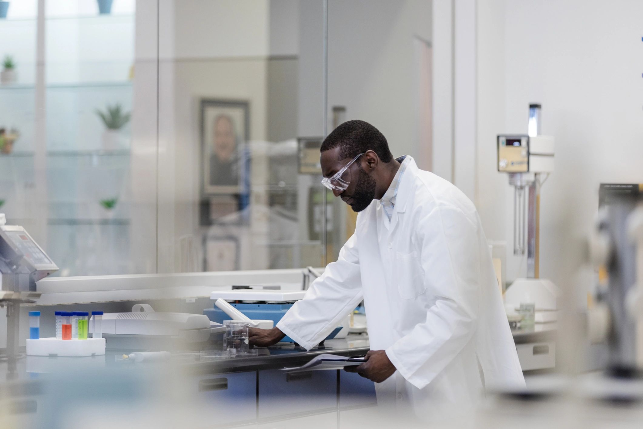 Researcher reading a lab report at a laboratory bench